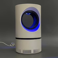 ZapiTrap lamp beside a bed with the USB cable visible